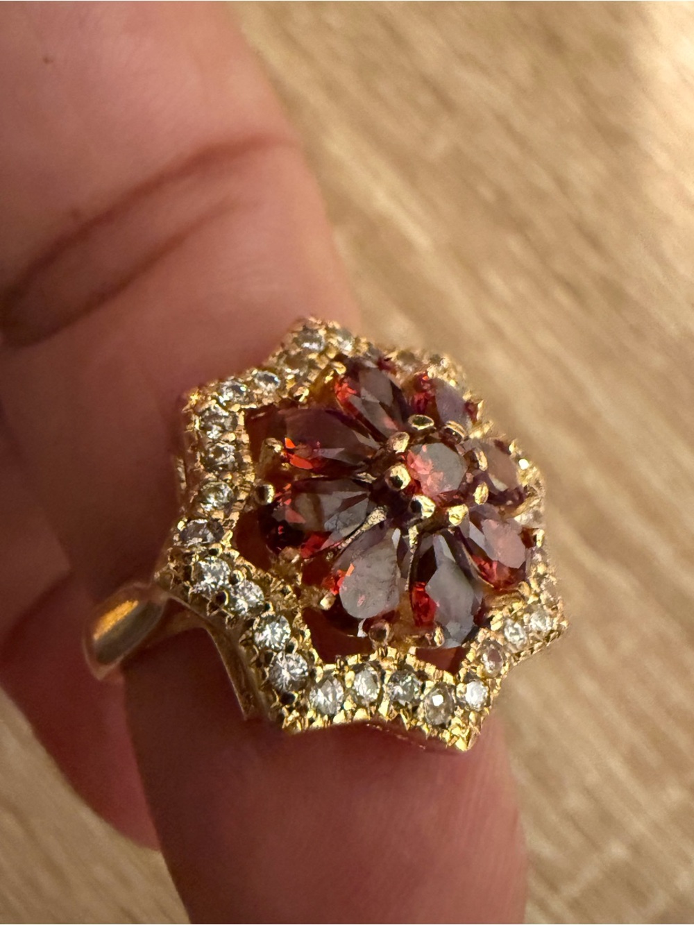 Gold-Tone Ring with Red Garnet-Style Stones and Clear Accents
